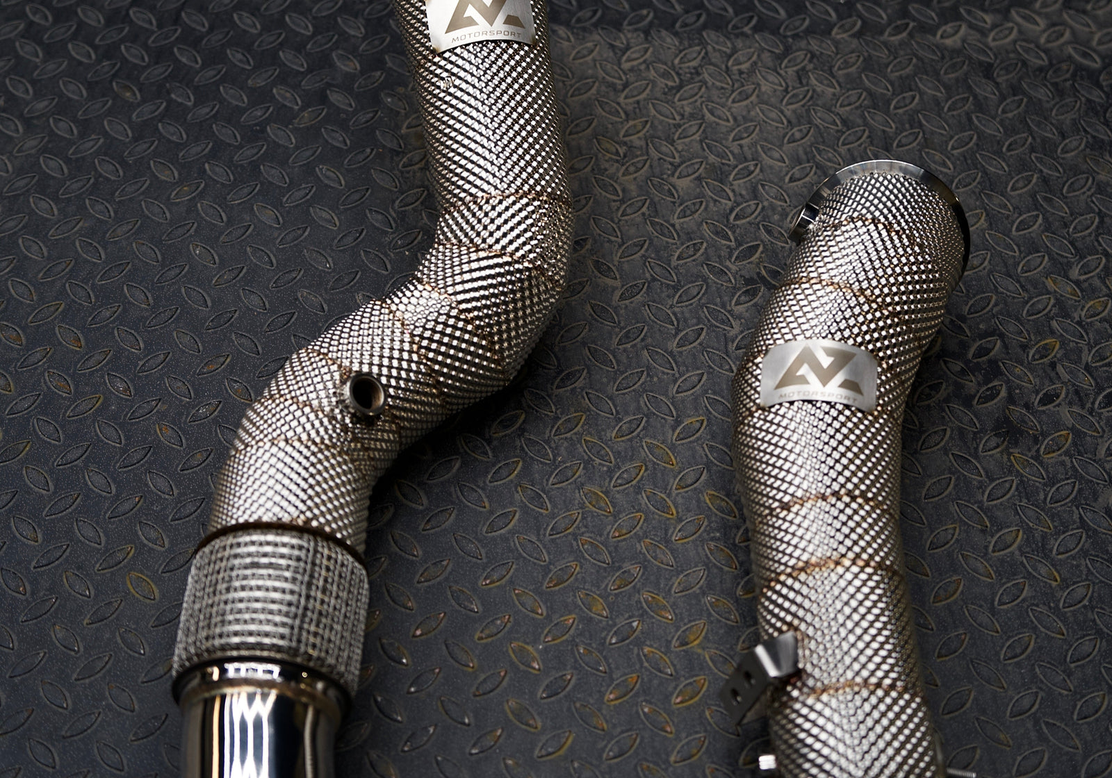 AZM S58 downpipes for the BMW M2, M3 and M4 on the bench