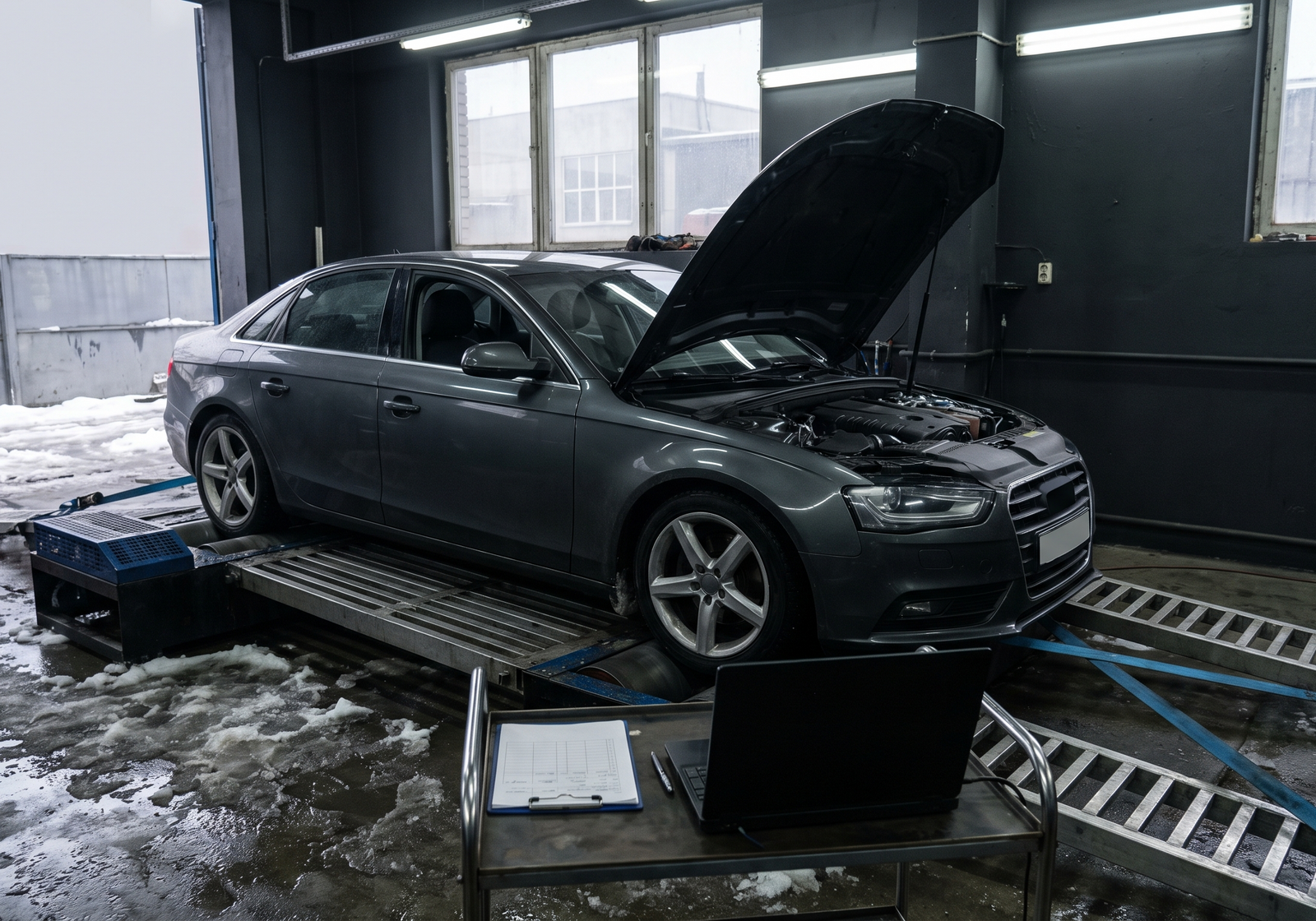 Generic sport sedan strapped to a chassis dyno in a Quebec tuning workshop for a dyno tuning prices and booking checklist